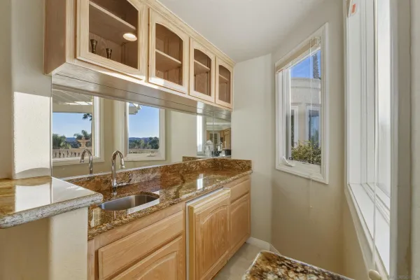a kitchen with a sink and a window