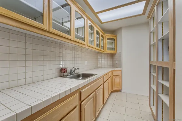 a kitchen with stainless steel appliances a sink and cabinets
