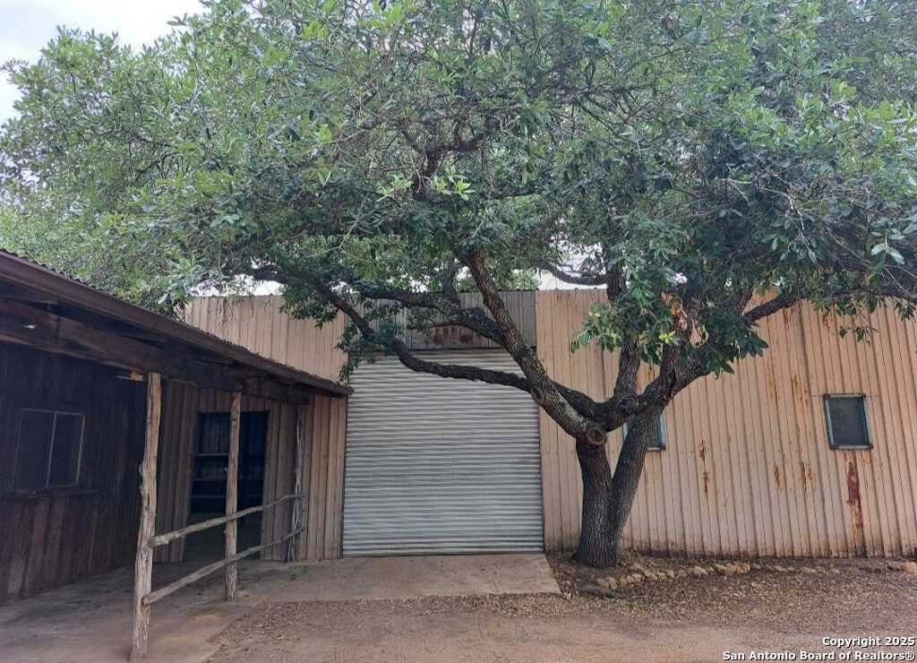 673 Zigmont Road San Antonio, TX 78263 - Photo 1 of 14 a house with a tree