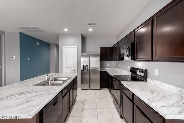 a kitchen with granite countertop lots of counter top space
