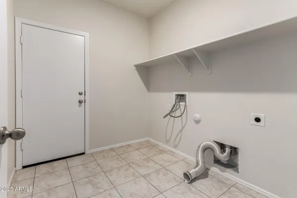 a view of a storage & utility room with racks on the wall