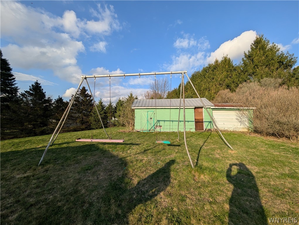 1040 Hughes Road Freedom, NY 14009 - Photo 32 of 34 Swing set stays, Shed boarded up shed sold as is.