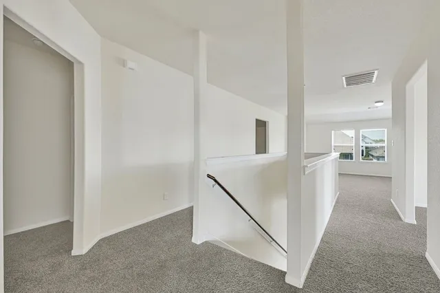 a view of a hallway with an entryway