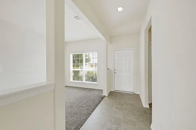 an empty room with windows