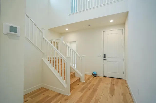 a view of hall way with front door