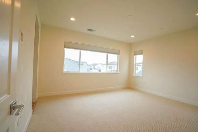 a bathroom with a granite countertop sink a toilet and shower