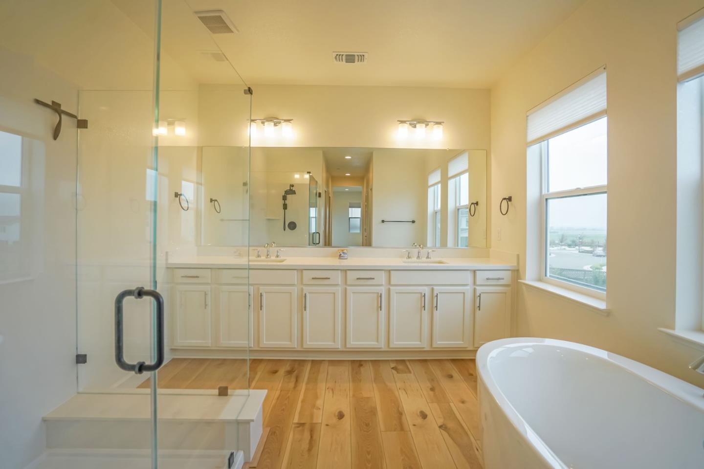 4124 Maddy Avenue Tracy, CA 95377 - Photo 35 of 55 a bathroom with a granite countertop sink a toilet and shower