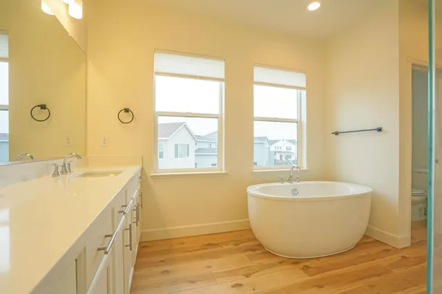 an empty room with windows and closet