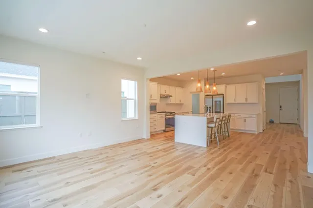 a view of kitchen and kitchen with furniture