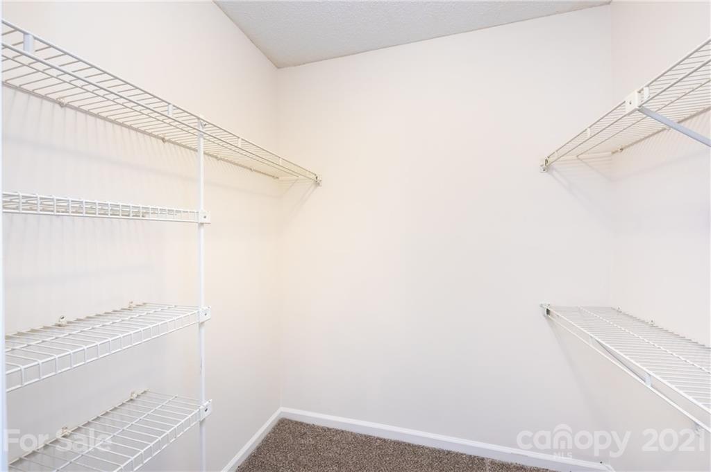 2539 Stockbridge Drive, Unit A Charlotte, NC 28210 - Photo 13 of 21 a bathroom with a shower and a white door