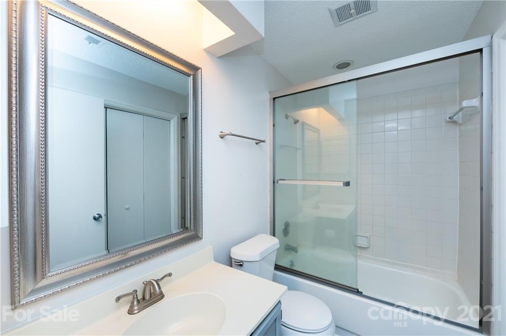 2539 Stockbridge Drive, Unit A Charlotte, NC 28210 - Photo 14 of 21 a bathroom with a sink and a mirror