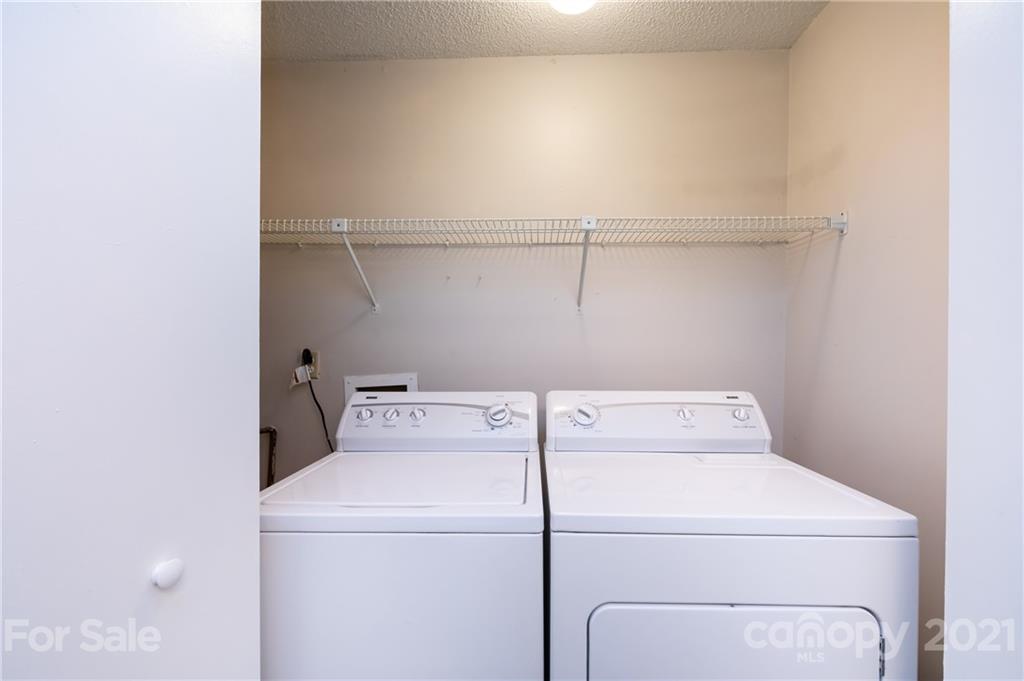 2539 Stockbridge Drive, Unit A Charlotte, NC 28210 - Photo 15 of 21 a utility room with dryer and washer