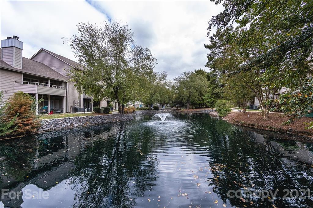 2539 Stockbridge Drive, Unit A Charlotte, NC 28210 - Photo 20 of 21 a backyard of a house with a yard and outdoor seating
