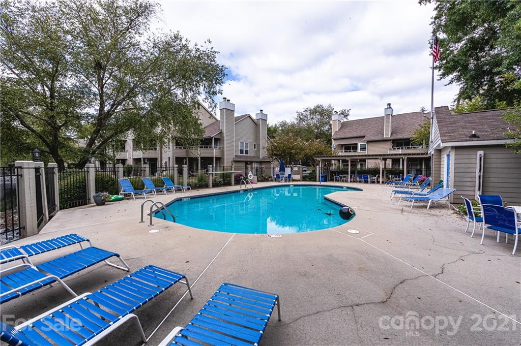 2539 Stockbridge Drive, Unit A Charlotte, NC 28210 - Photo 21 of 21 a view of a swimming pool with a patio
