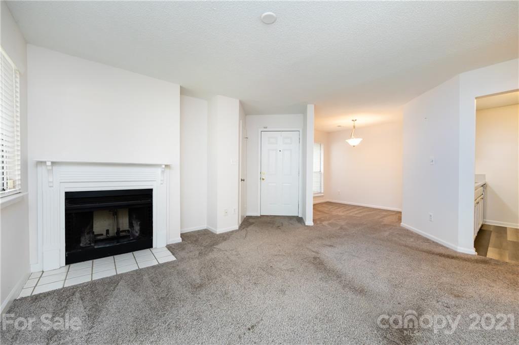 2539 Stockbridge Drive, Unit A Charlotte, NC 28210 - Photo 8 of 21 a view of empty room with a fireplace