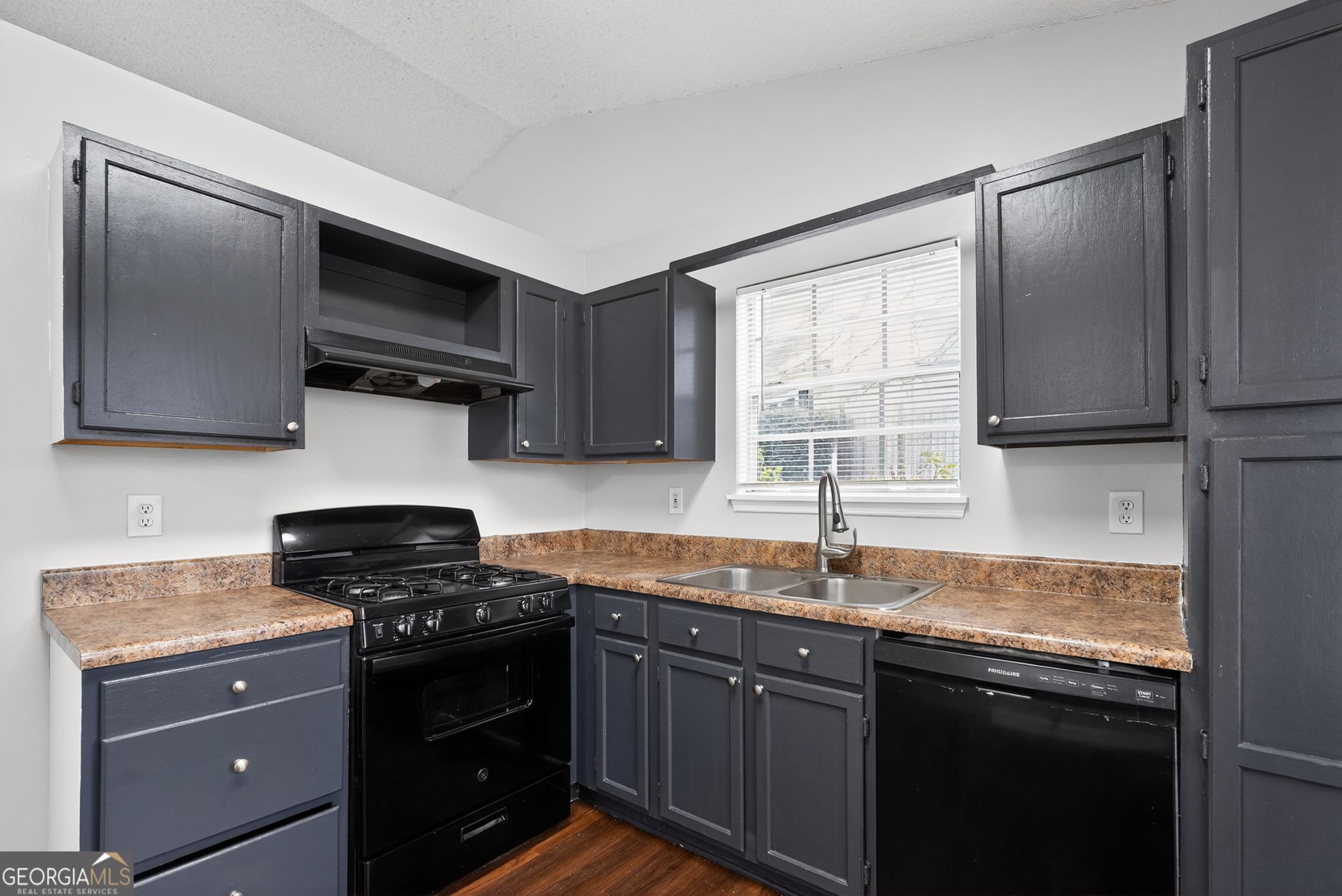 3263 River Mist Cove Decatur, GA 30034 - Photo 12 of 38 a kitchen with stainless steel appliances granite countertop a sink stove and microwave