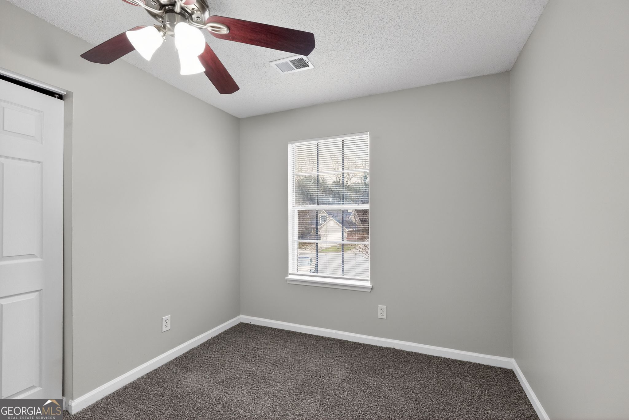 3263 River Mist Cove Decatur, GA 30034 - Photo 18 of 38 an empty room with windows and fan