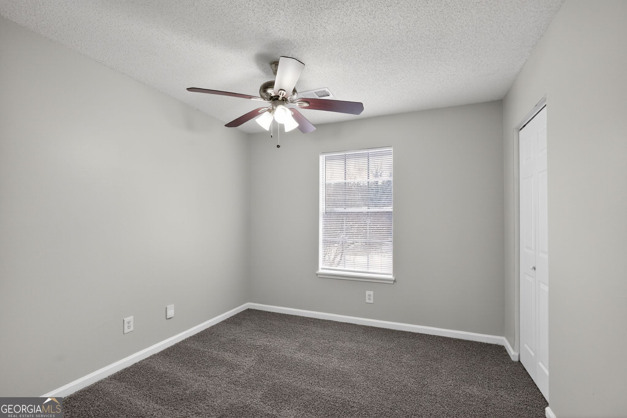 3263 River Mist Cove Decatur, GA 30034 - Photo 21 of 38 an empty room with windows and fan