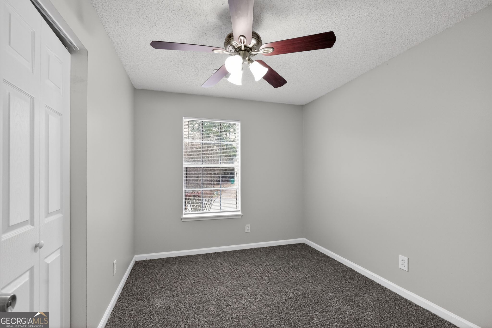 3263 River Mist Cove Decatur, GA 30034 - Photo 24 of 38 an empty room with windows and fan