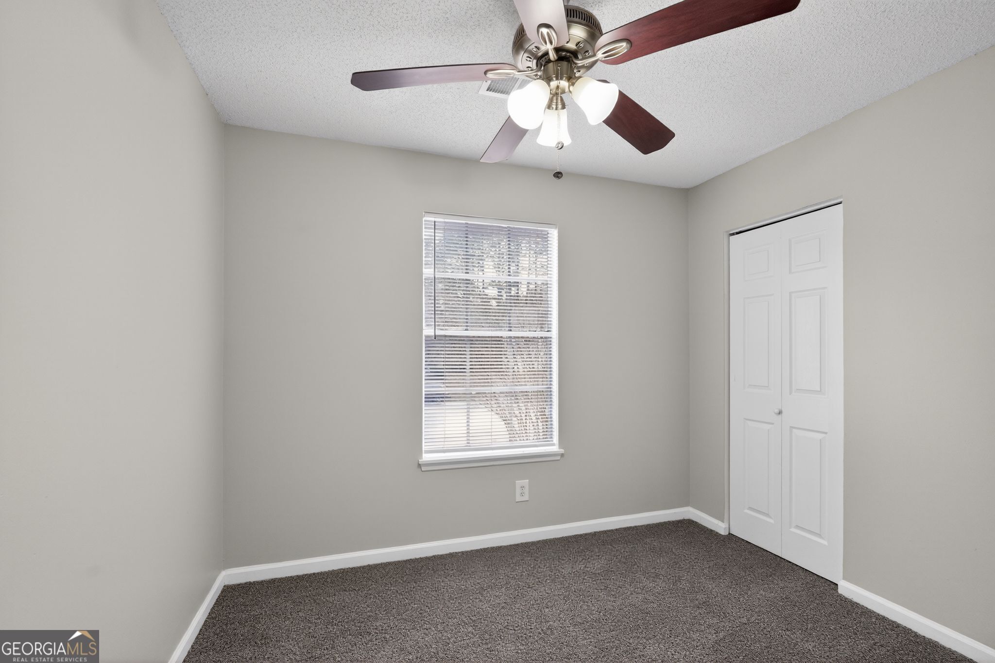 3263 River Mist Cove Decatur, GA 30034 - Photo 25 of 38 an empty room with windows and fan