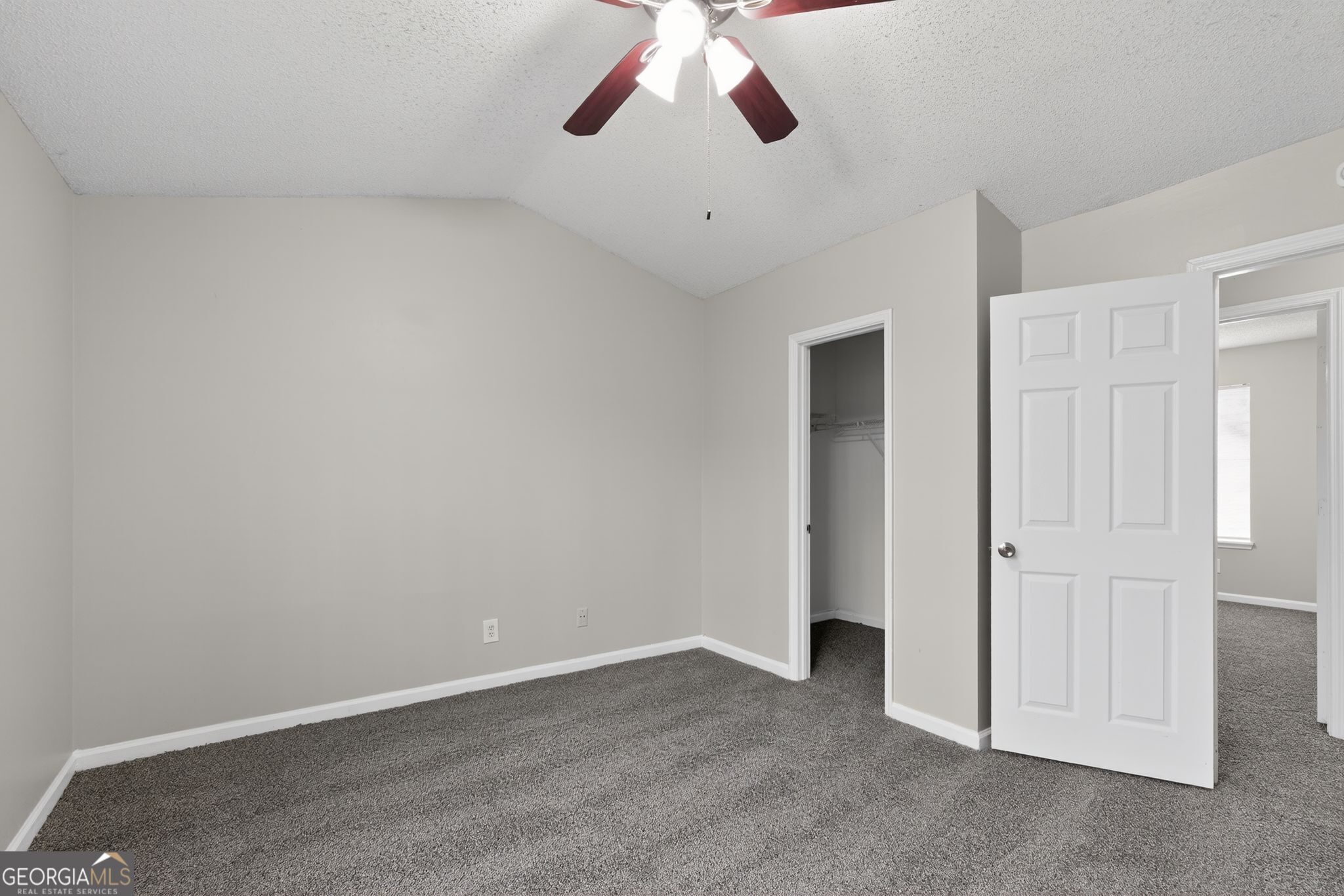 3263 River Mist Cove Decatur, GA 30034 - Photo 28 of 38 a view of an empty room with a ceiling fan