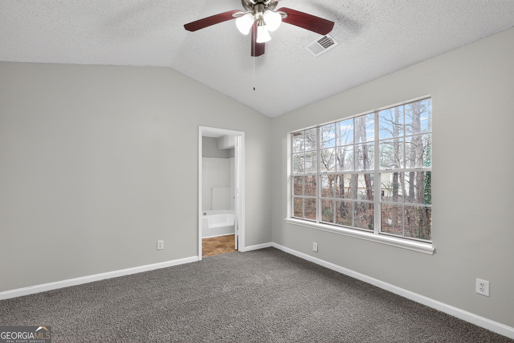 3263 River Mist Cove Decatur, GA 30034 - Photo 29 of 38 a view of an empty room with a window
