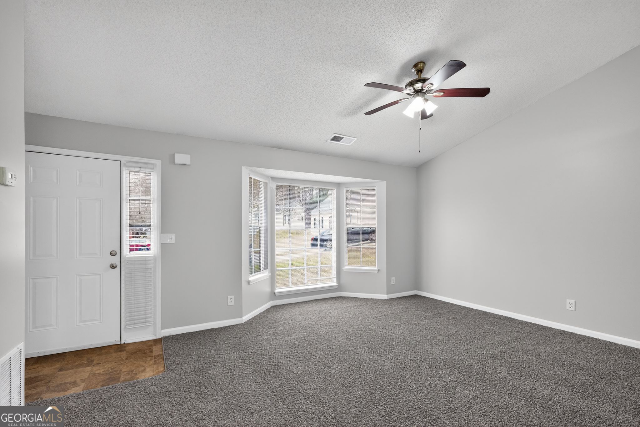 3263 River Mist Cove Decatur, GA 30034 - Photo 4 of 38 a view of an empty room with a window