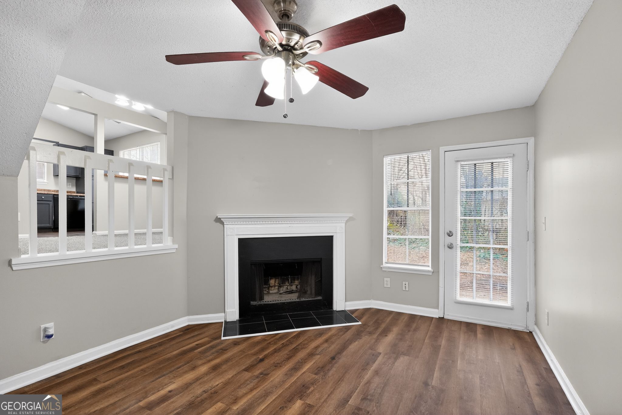 3263 River Mist Cove Decatur, GA 30034 - Photo 9 of 38 wooden floor fireplace and windows in an empty room