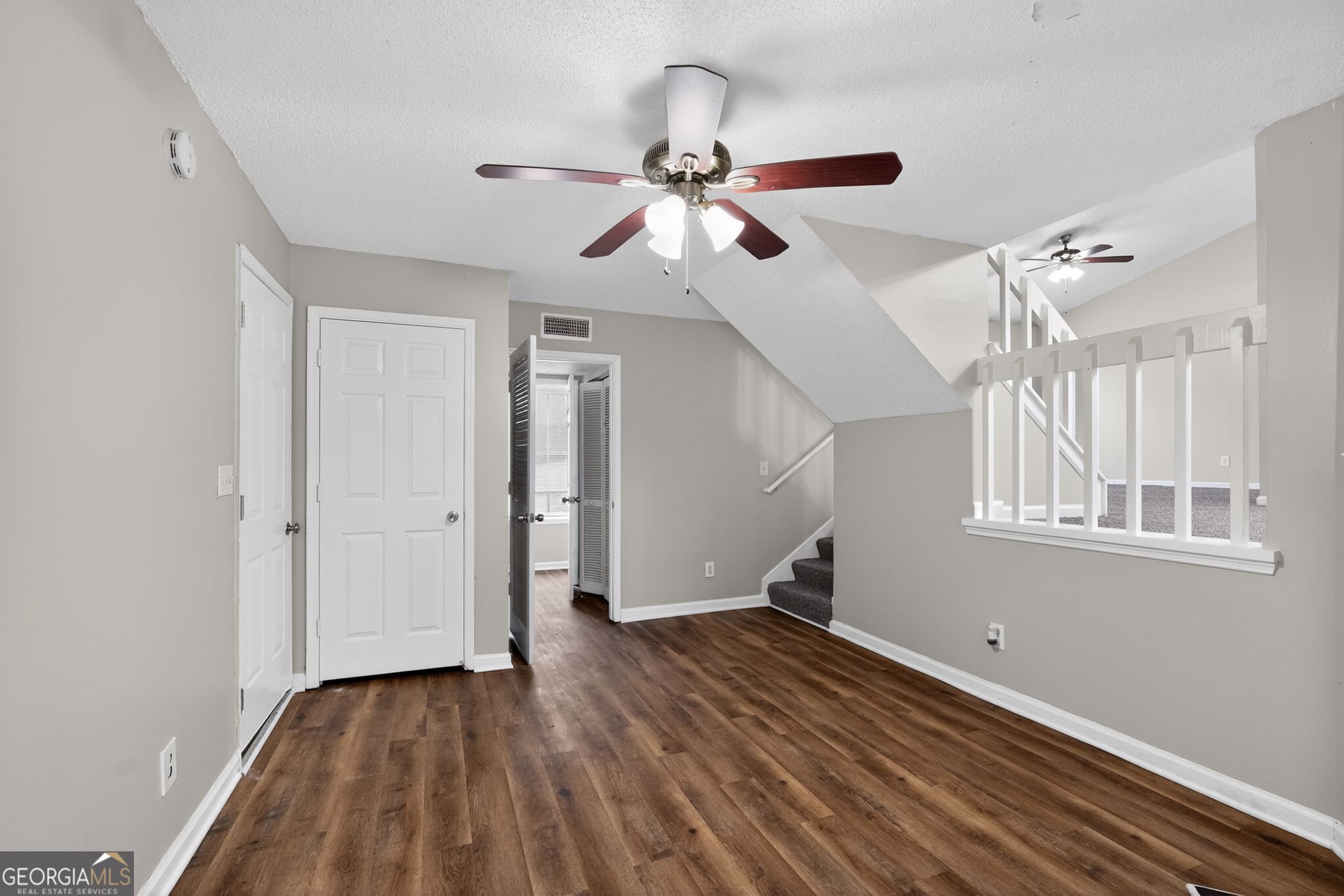 3263 River Mist Cove Decatur, GA 30034 - Photo 10 of 38 a view of empty room with wooden floor and fan
