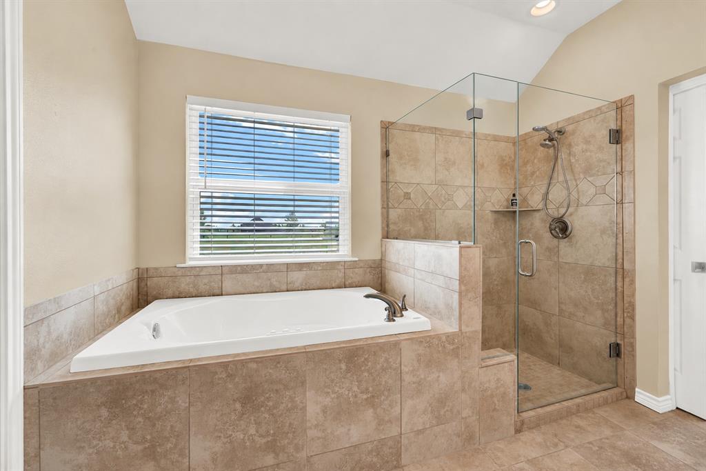 736 Audra Circle Rhome, TX 76078 - Photo 12 of 30 Primary Ensuite Bath. Rendered frameless shower glass to be installed.