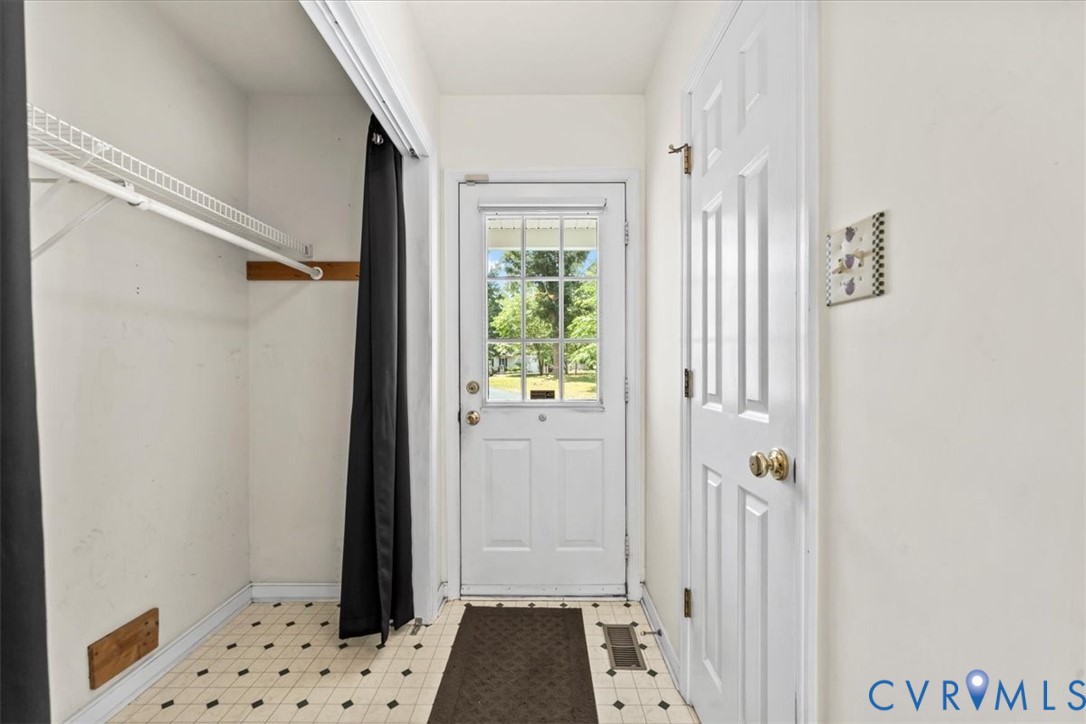 2924 Warfield Ridge Terrace Chester, VA 23831 - Photo 24 of 38 Entryway featuring a glass-paneled door, patterned