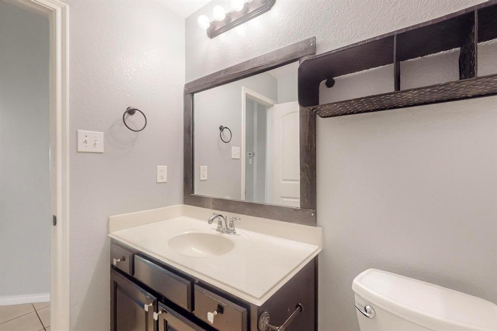 970 Austin Lane Lavon, TX 75166 - Photo 12 of 26 a bathroom with a sink toilet and mirror
