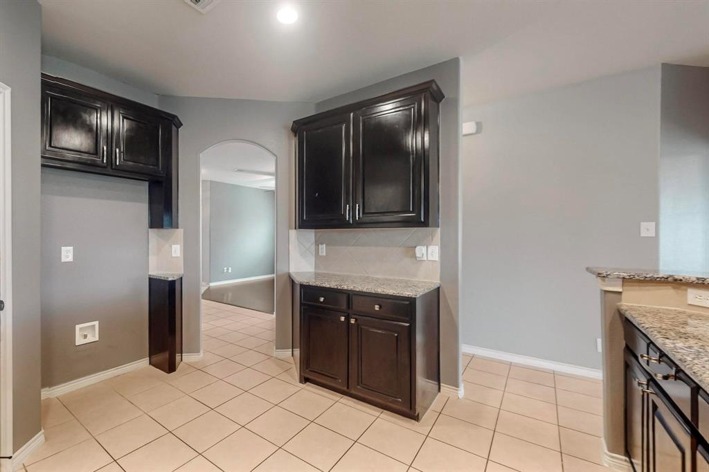 970 Austin Lane Lavon, TX 75166 - Photo 16 of 26 a kitchen with stainless steel appliances granite countertop a refrigerator and a stove top oven