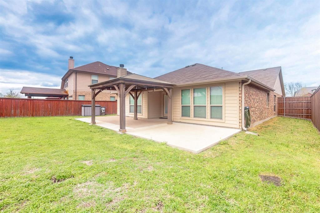 970 Austin Lane Lavon, TX 75166 - Photo 20 of 26 a view of a house with backyard and porch