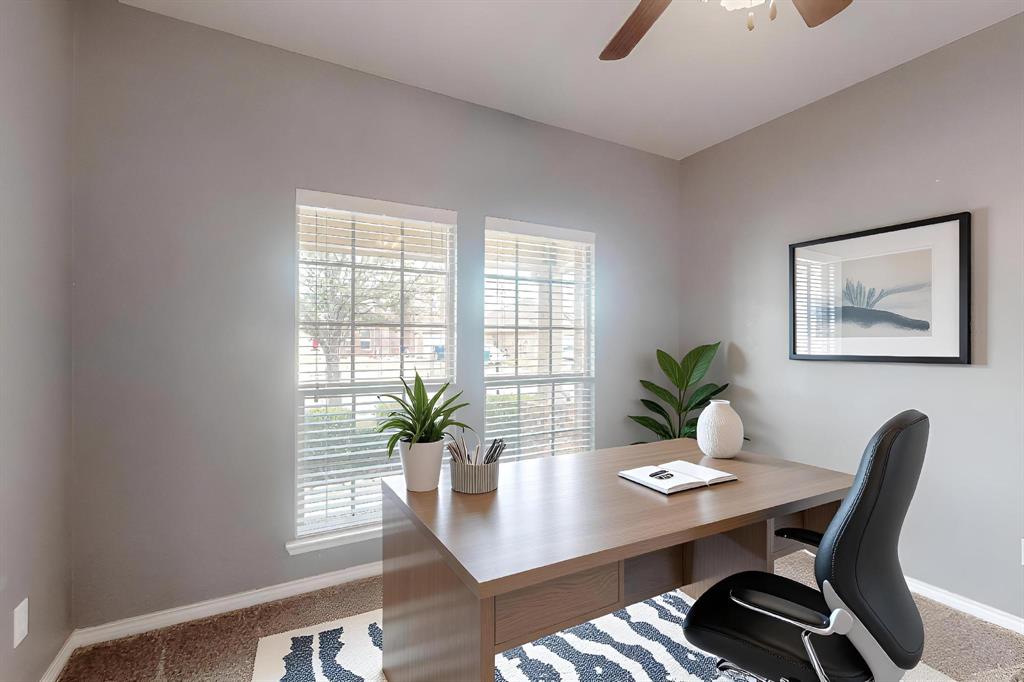 970 Austin Lane Lavon, TX 75166 - Photo 4 of 26 a view of a workspace with a table and chair in a room