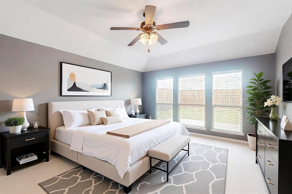 970 Austin Lane Lavon, TX 75166 - Photo 8 of 26 a bedroom with a large bed a chandelier and windows