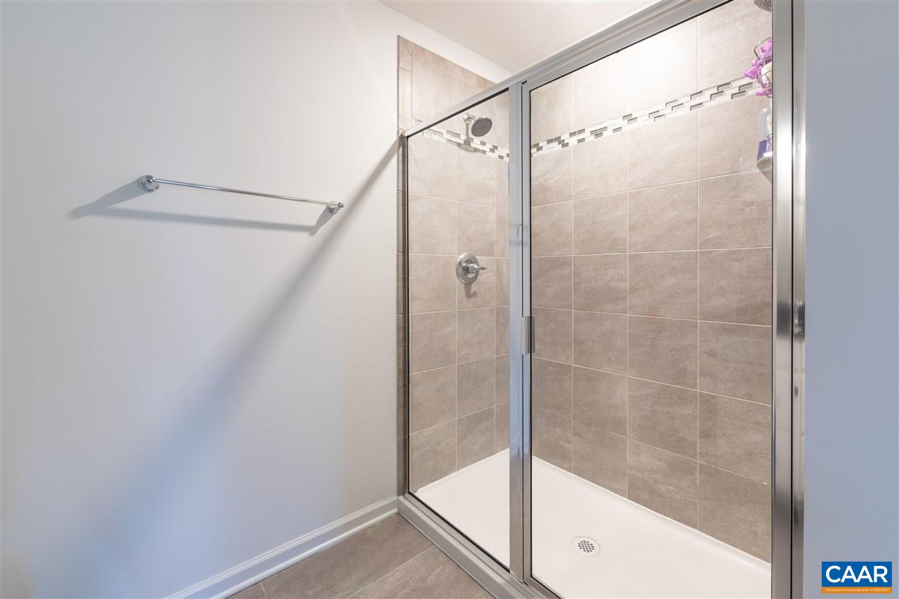 293 Ridgemont Road Ruckersville, VA 22968 - Photo 19 of 23 a bathroom with a glass shower door