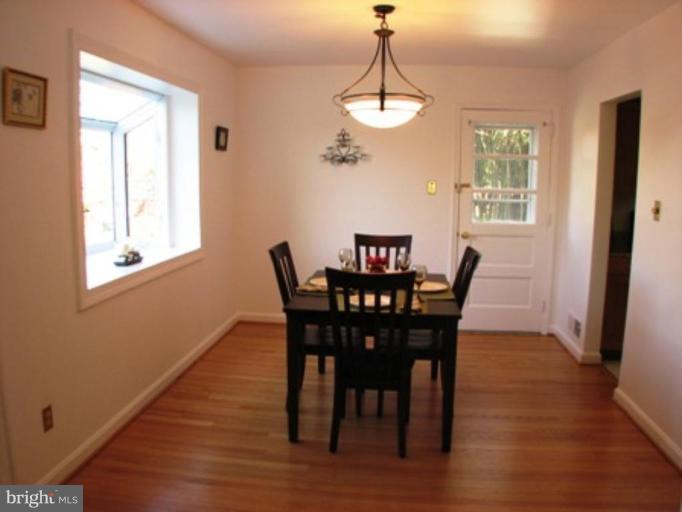 3713 North Glebe Road Arlington, VA 22207 - Photo 12 of 30 a view of a dining room with furniture window and wooden floor