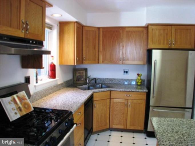 3713 North Glebe Road Arlington, VA 22207 - Photo 14 of 30 a kitchen with a sink stove and refrigerator