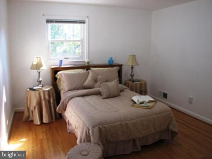 3713 North Glebe Road Arlington, VA 22207 - Photo 20 of 30 a bedroom with a bed and a window