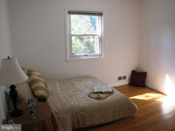 3713 North Glebe Road Arlington, VA 22207 - Photo 23 of 30 a bedroom with a bed and window
