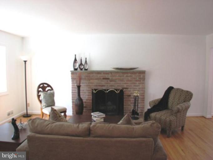 3713 North Glebe Road Arlington, VA 22207 - Photo 9 of 30 a living room with furniture and a fireplace