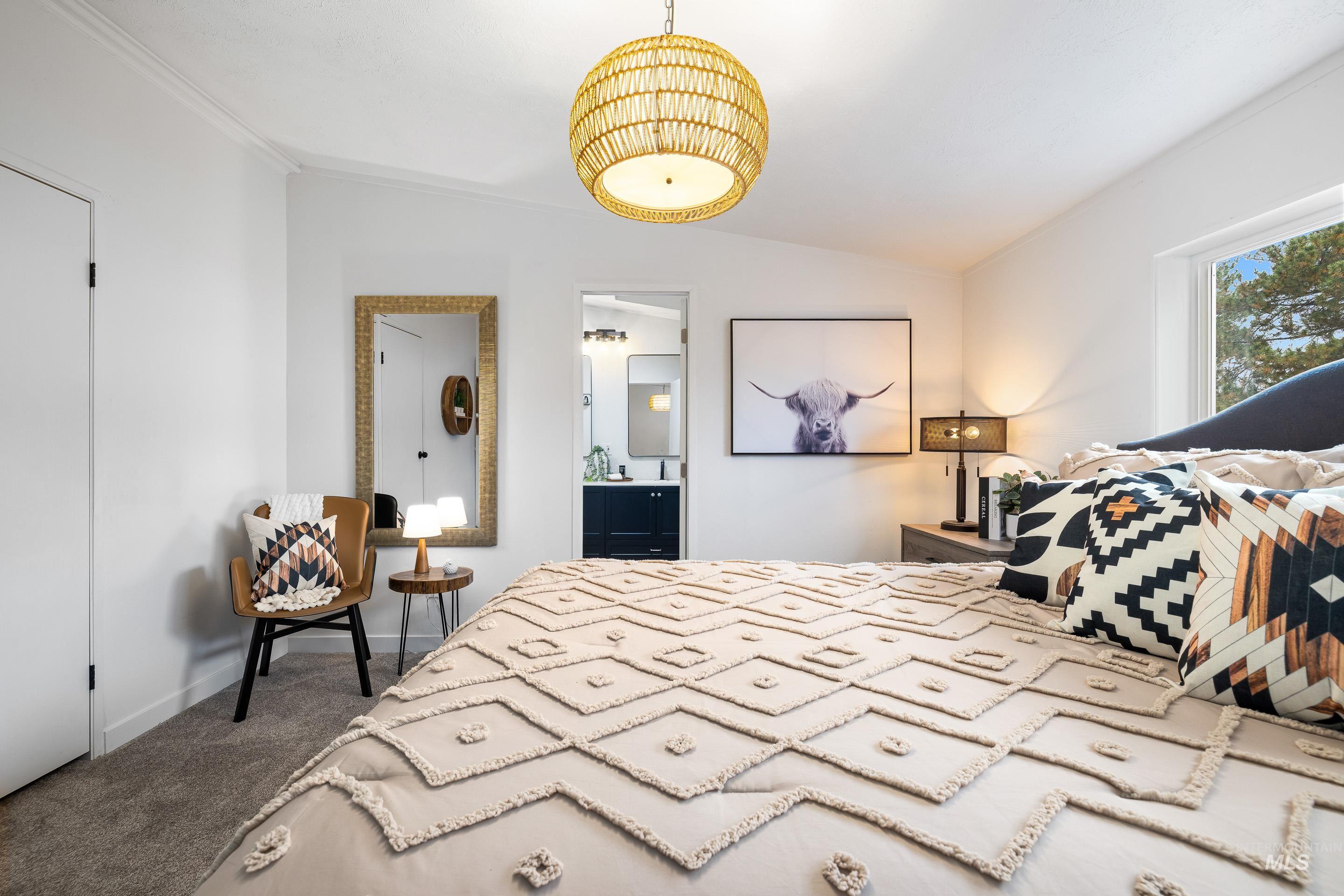 10014 Dewitt Lane Boise, ID 83704 - Photo 31 of 50 Bedroom featuring vaulted ceiling, dark colored carpet, and ensuite bathroom