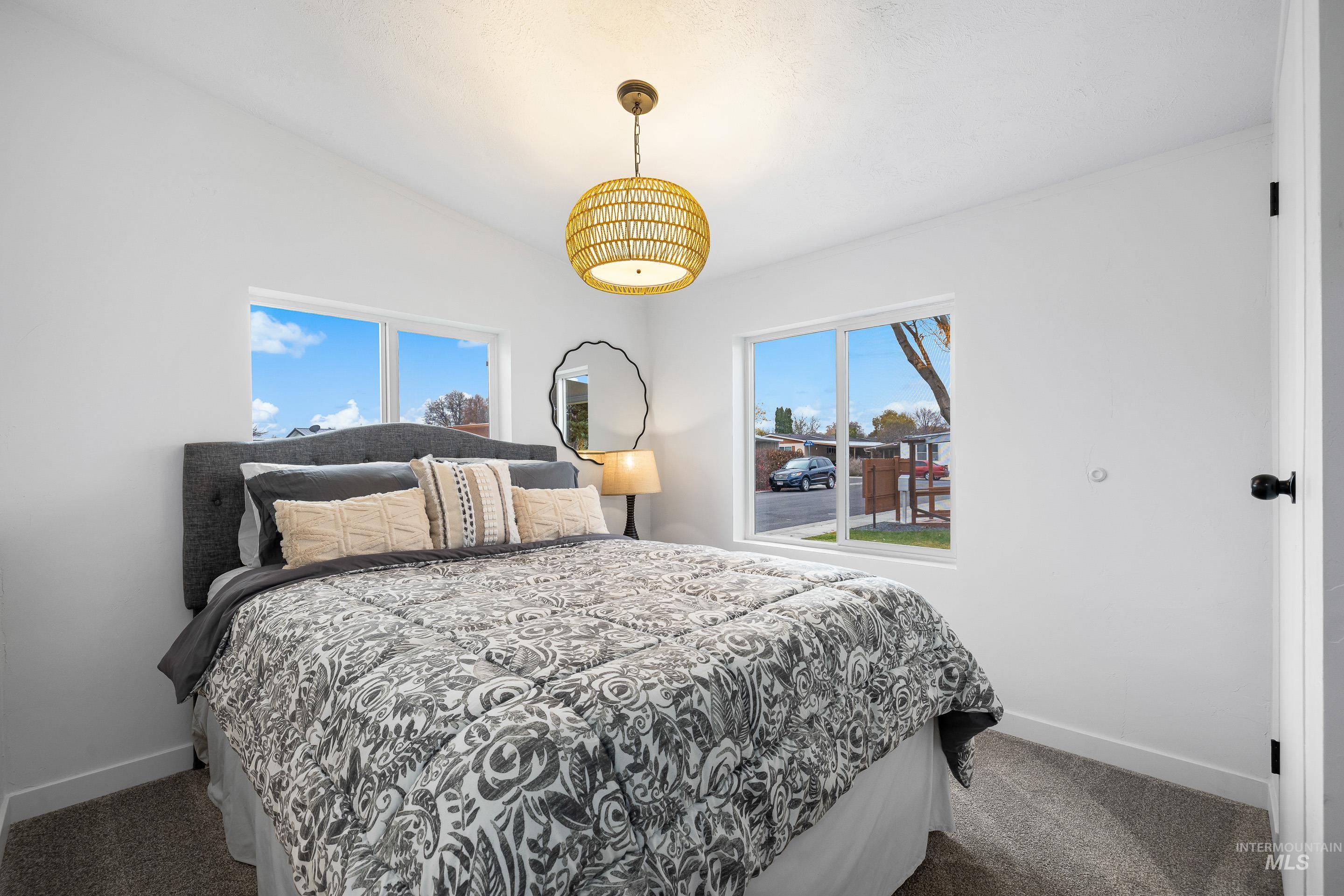 10014 Dewitt Lane Boise, ID 83704 - Photo 38 of 50 Bedroom featuring dark colored carpet