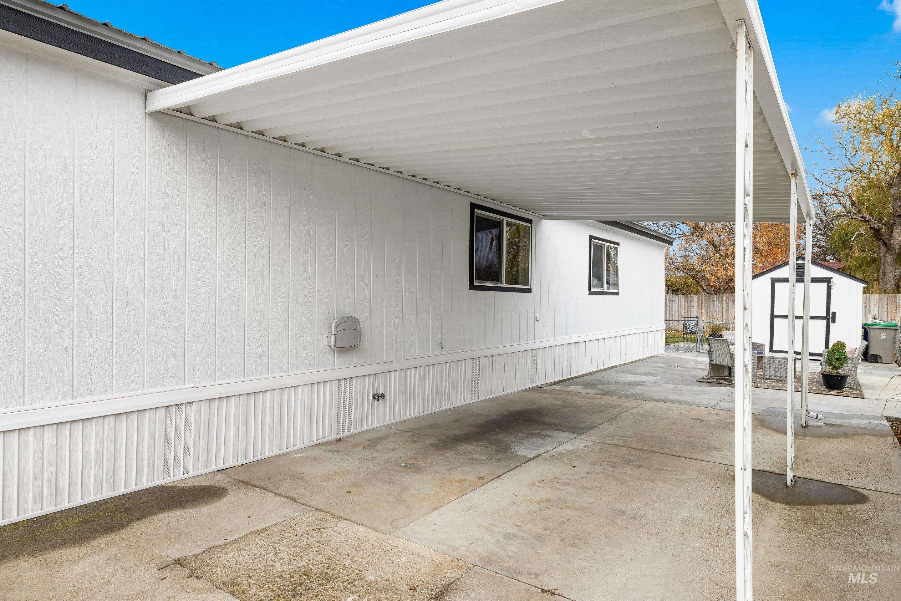 10014 Dewitt Lane Boise, ID 83704 - Photo 5 of 50 View of patio / terrace featuring a storage unit and an attached carport