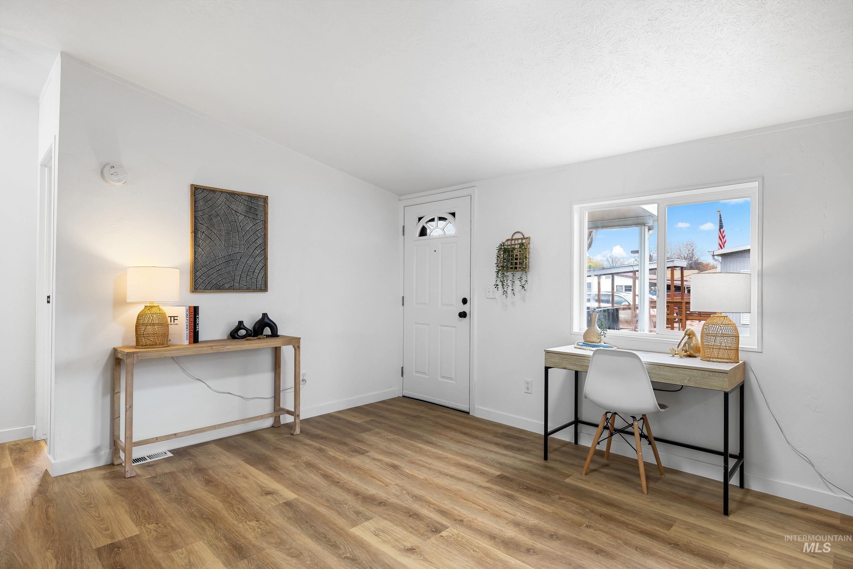10014 Dewitt Lane Boise, ID 83704 - Photo 7 of 50 Office area featuring light wood-style floors and baseboards
