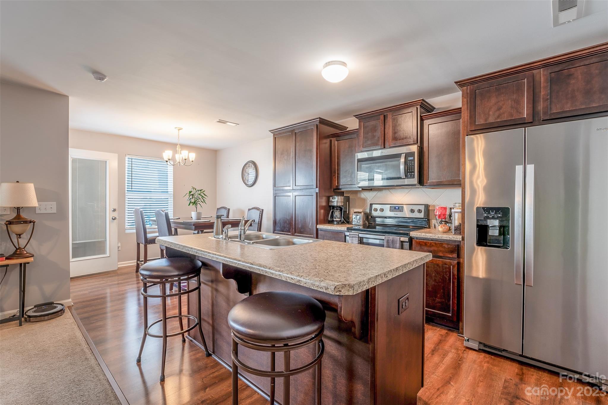 12538 Garron Road Midland, NC 28107 - Photo 3 of 29 a kitchen with granite countertop a center island and stainless steel appliances