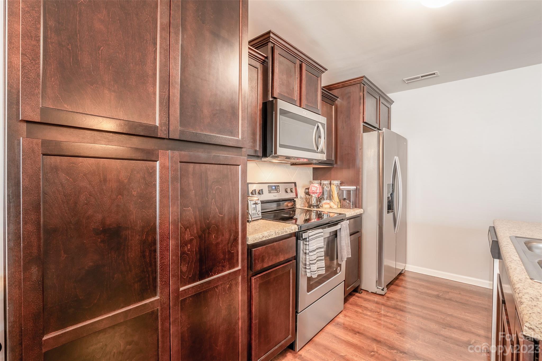 12538 Garron Road Midland, NC 28107 - Photo 5 of 29 a kitchen with stainless steel appliances granite countertop a refrigerator a stove and a sink