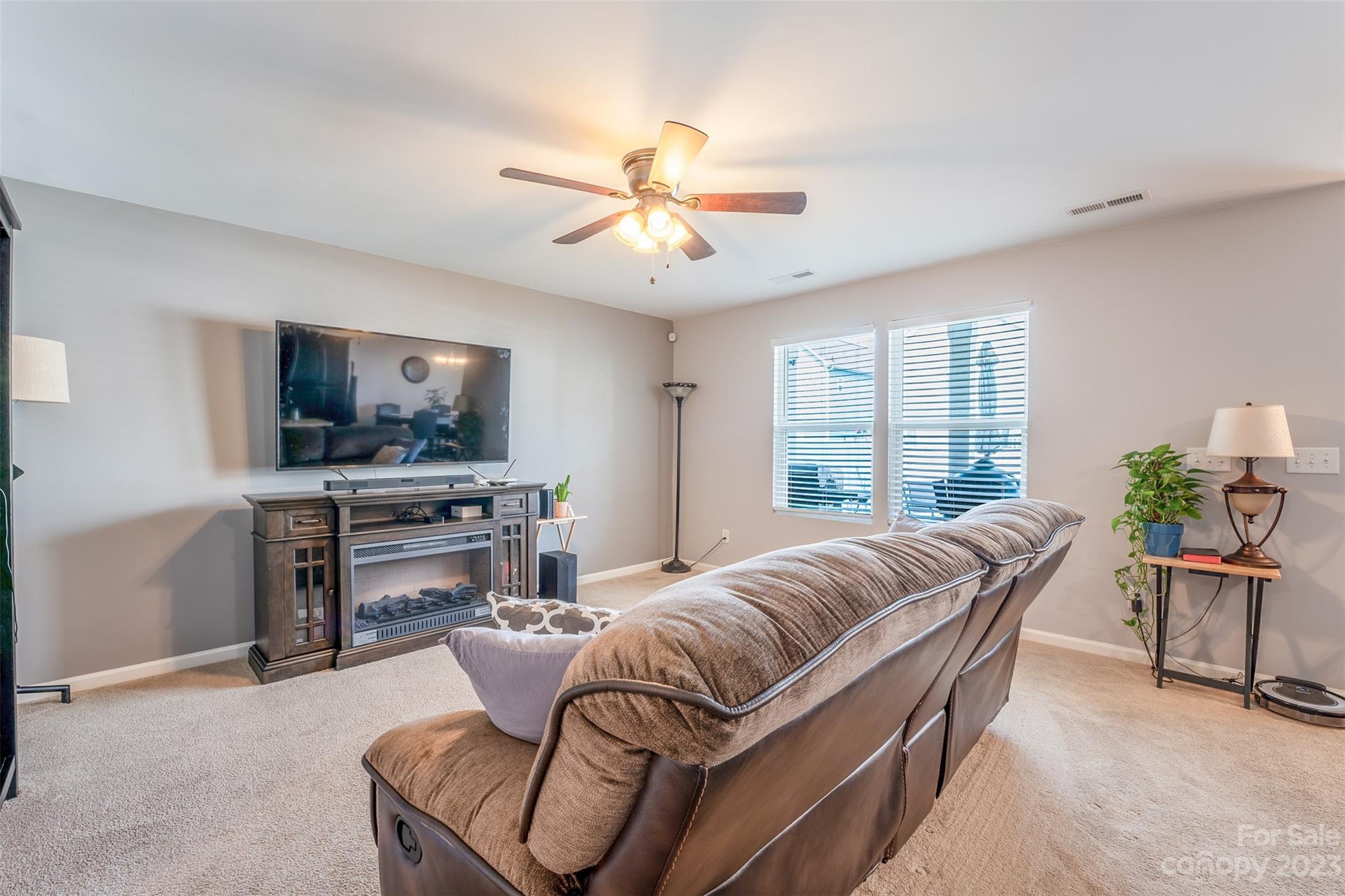 12538 Garron Road Midland, NC 28107 - Photo 8 of 29 a living room with furniture and a flat screen tv