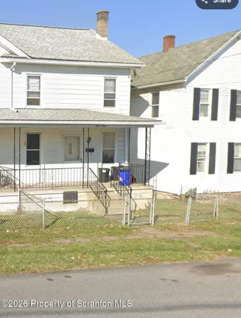 a view of a house with a swimming pool